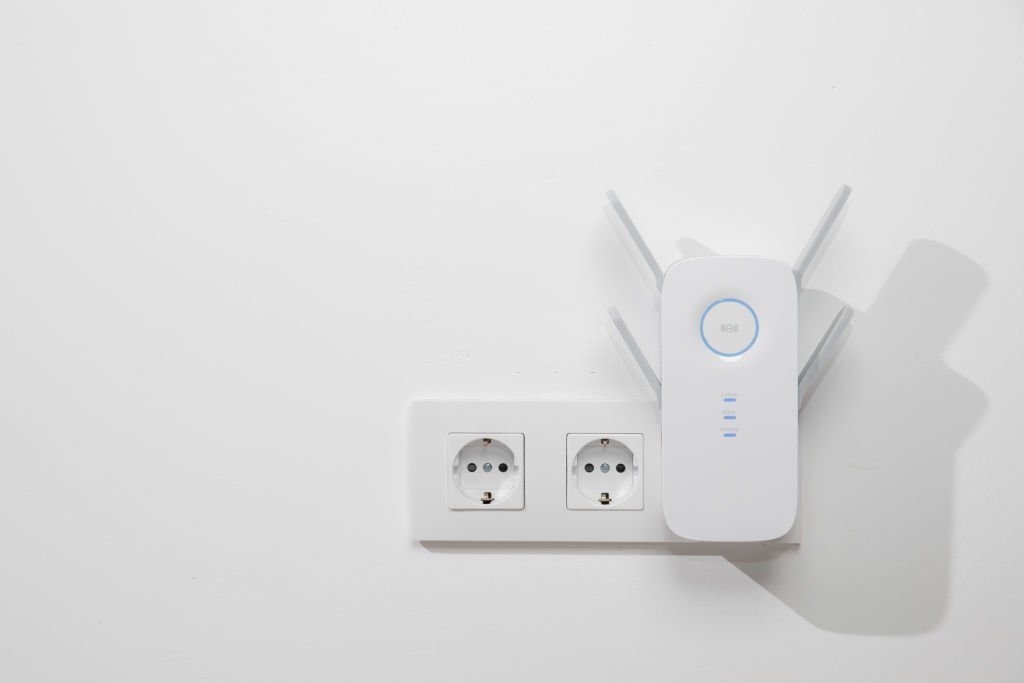 What is a wireless range extender, and how does it work?